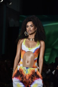 a model walks the runway at miami fashion week