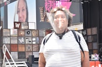 a woman wearing a white striped shirt