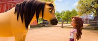 a girl is standing next to a horse in an animated movie