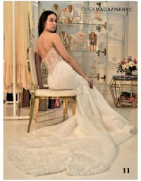 a woman in a wedding dress sitting on a chair