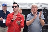 a man in a red shirt and a man in a red shirt clapping