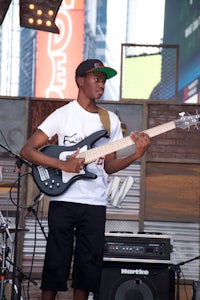 a man playing a bass guitar