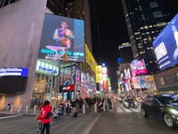 times square at night with large billboards