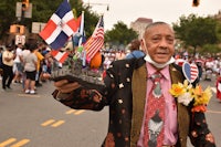 a man in a suit holding a flag