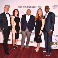 a group of people posing for a picture on the red carpet