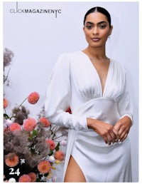 a woman in a white dress is posing in front of flowers