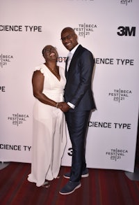 a man and woman posing for a photo at the science type premiere