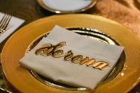 a gold napkin with the name serena on it