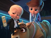 the boss baby is riding on top of a horse