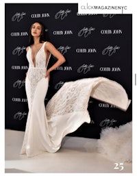 a woman in a white gown is posing on the red carpet