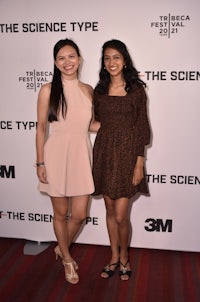 two women posing for a photo on the red carpet