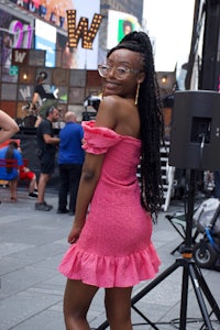 a woman in a pink dress