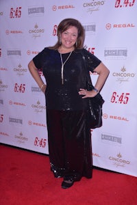 a woman posing on a red carpet