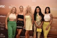 a group of women posing for a photo at an event