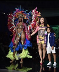 two women and a child standing on a runway