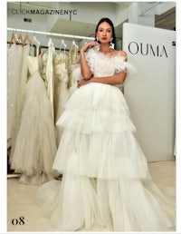 a woman is posing in a wedding dress